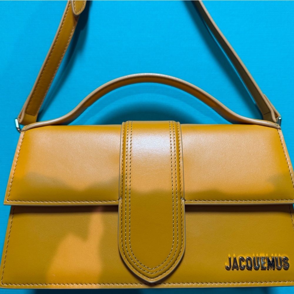 Jaquemus creamsicle colored purse